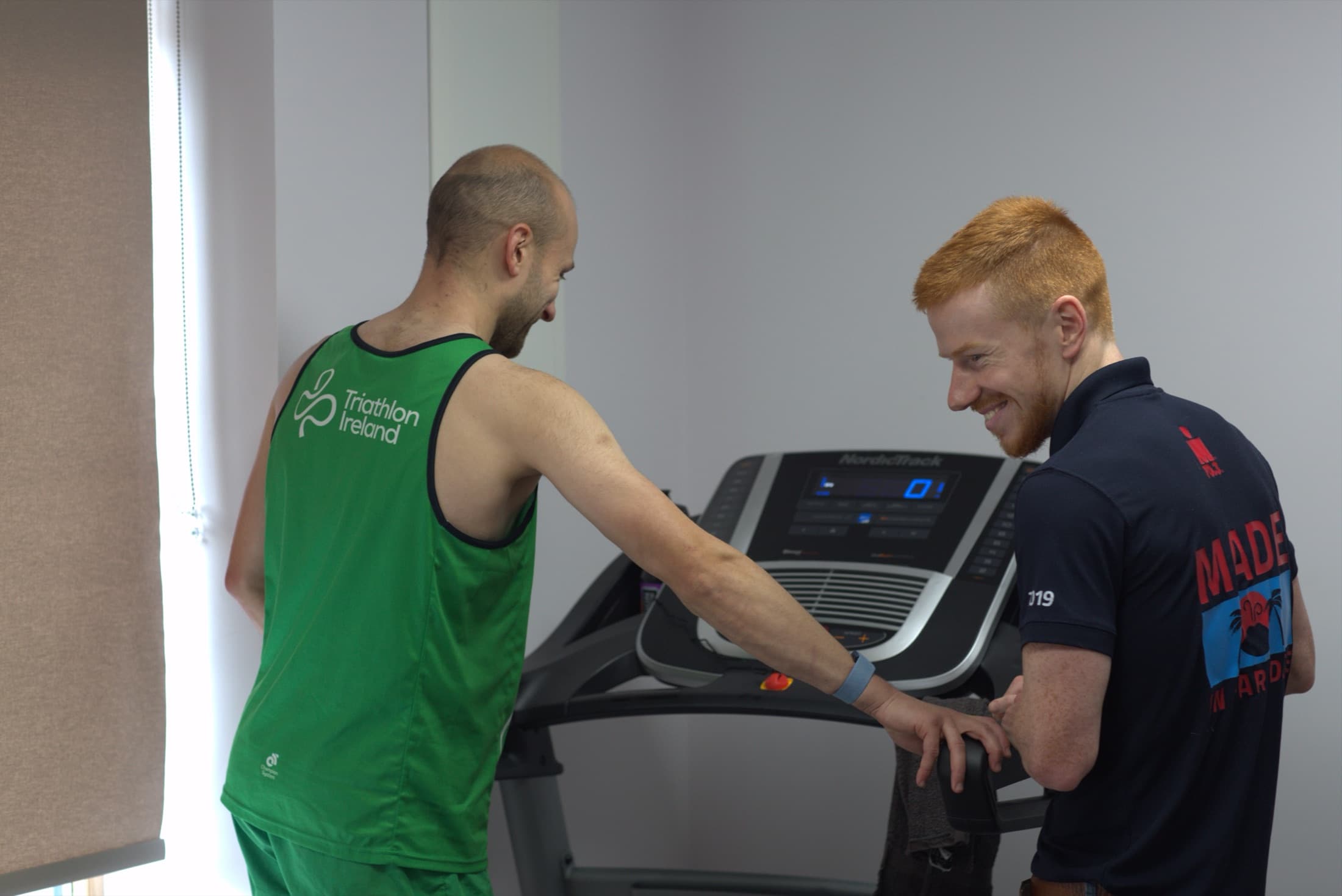 Sean taking a blood lactate sample during a treadmill test in the lab